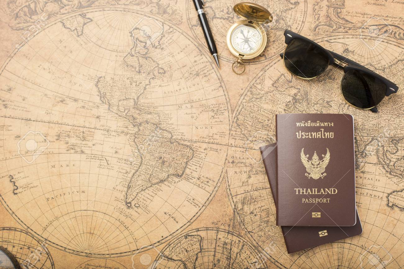 planning travel concept thailand passport on old map stock photo