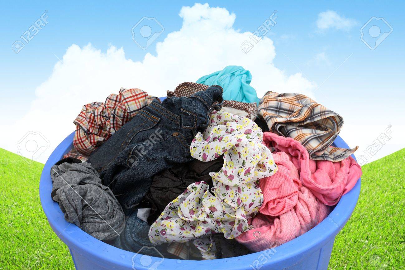 Washing Clothes In A Bucket Of Water 