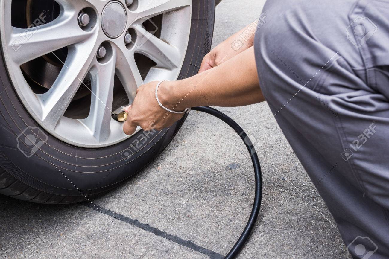 Someone Is Pumping A Tire Before Traveling Stock Photo, Picture And Royalty  Free Image. Image 43782496.