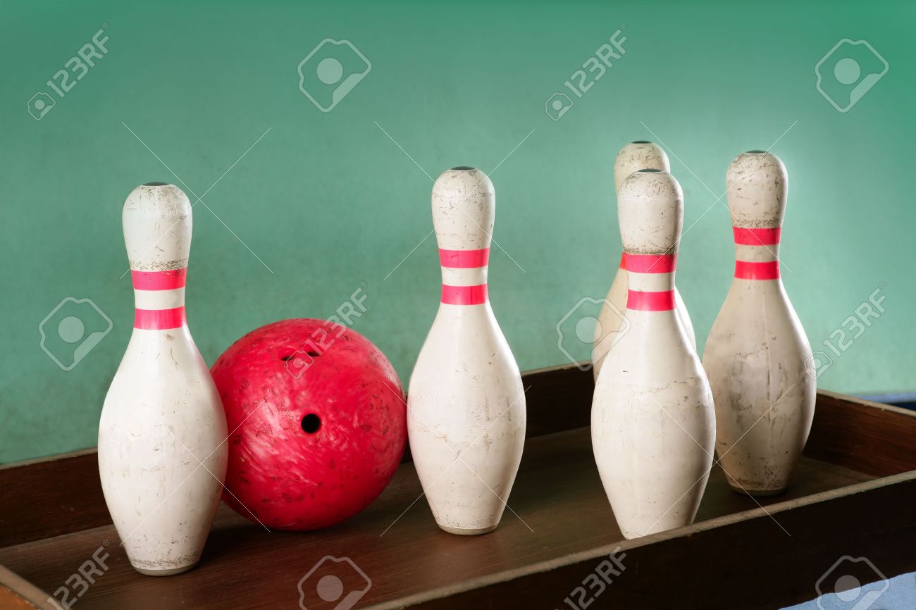 Bowling still life red ball games over green background Stock Photo - 6128721
