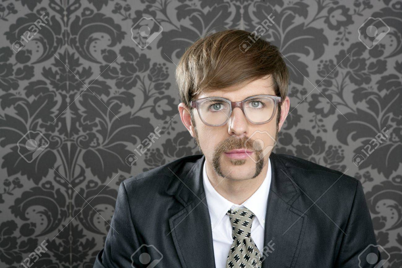 businessman nerd retro glasses geek portrait on vintage wallpaper