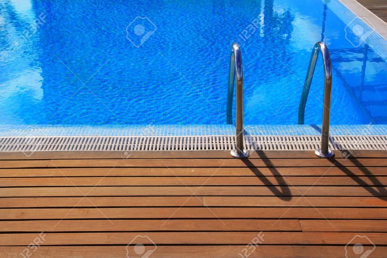 Blue Swimming Pool With Teak Wood Flooring Deck Summer Vacation Stock Photo Picture And Royalty Free Image Image 10438087