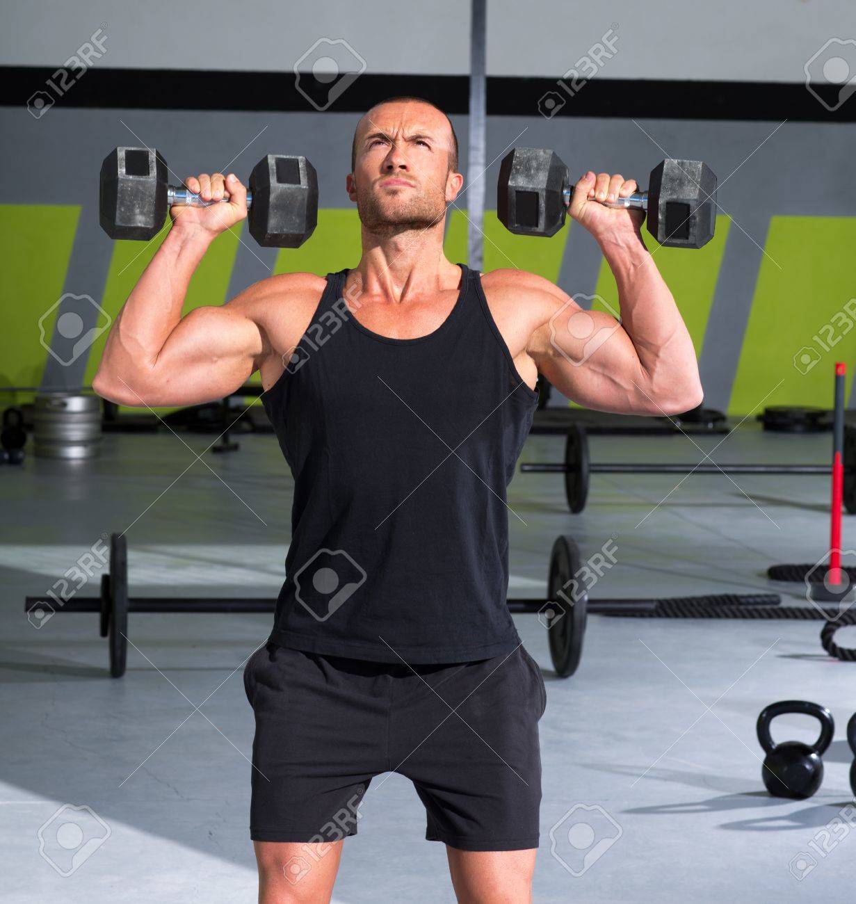 gym man with dumbbells