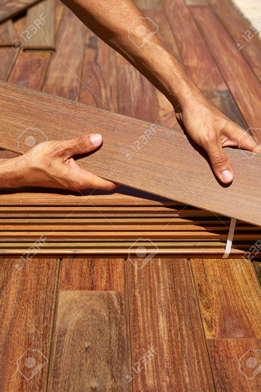 ipe decking installation tongue groove ipe decking installation with carpenter hands holding tropical wood slats stock photo 41347370 decking installation with carpenter hands holding tropical ipe decking installation tongue groove ipe decking installation with carpenter hands holding tropical wood slats stock photo 41347370 decking installation with carpenter hands holding tropical
