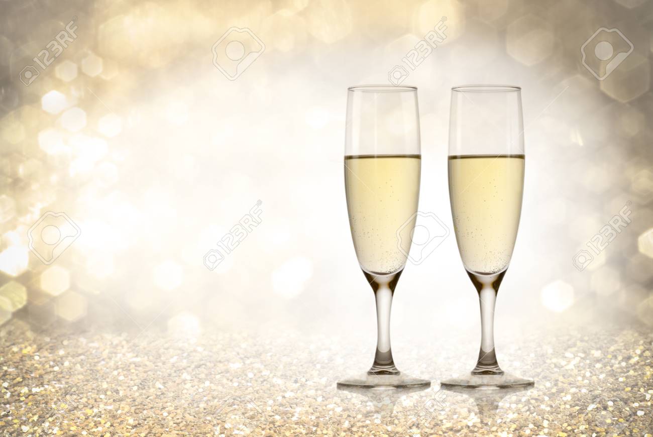 a champagne toast happy new year golden background stock photo