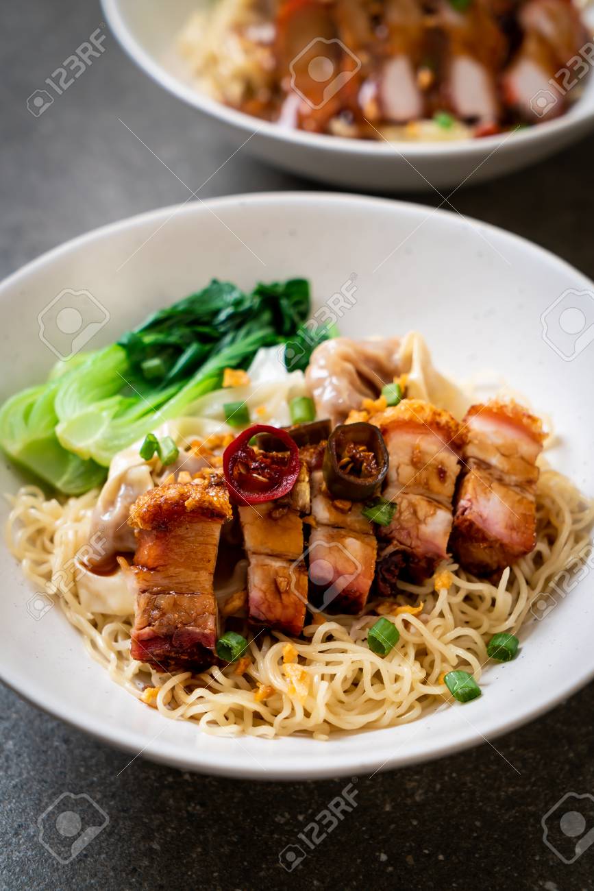 Egg Noodle Soup With Crispy Pork Belly And Wonton Asian Food Style Stock Photo Picture And Royalty Free Image Image