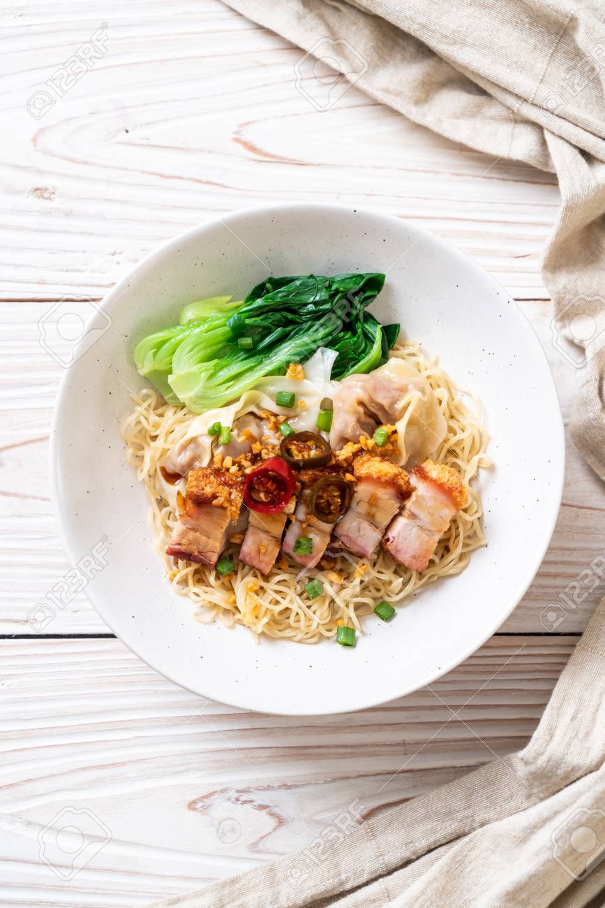 Egg Noodle Soup With Crispy Pork Belly And Wonton Asian Food Style Stock Photo Picture And Royalty Free Image Image