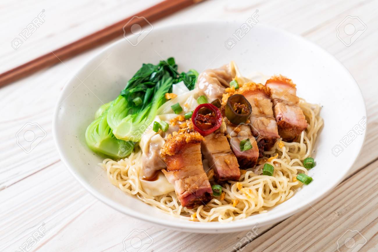 Egg Noodle Soup With Crispy Pork Belly And Wonton Asian Food Style Stock Photo Picture And Royalty Free Image Image