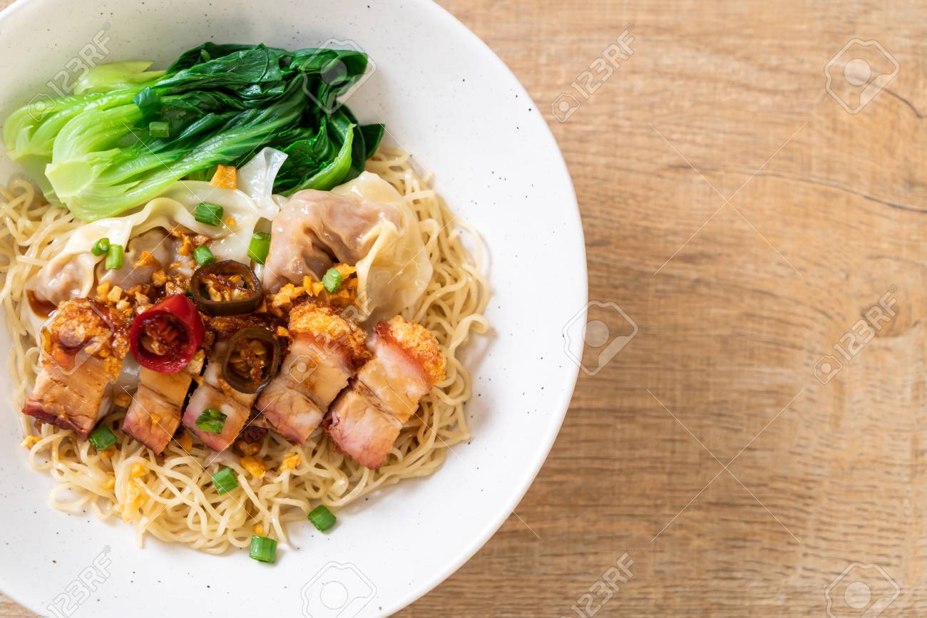 Egg Noodle Soup With Crispy Pork Belly And Wonton Asian Food Style Stock Photo Picture And Royalty Free Image Image