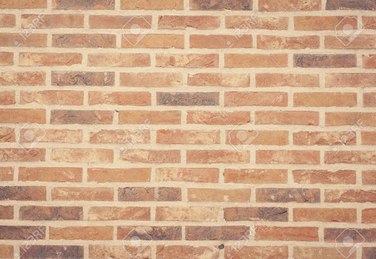 茶色の石レンガの壁のテクスチャとシームレスな背景 の写真素材 画像素材 Image