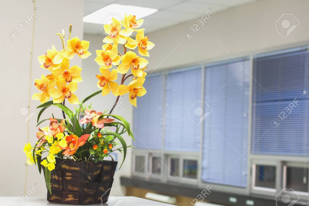 beautiful fresh flowers in the office for background soft focus office flowers
