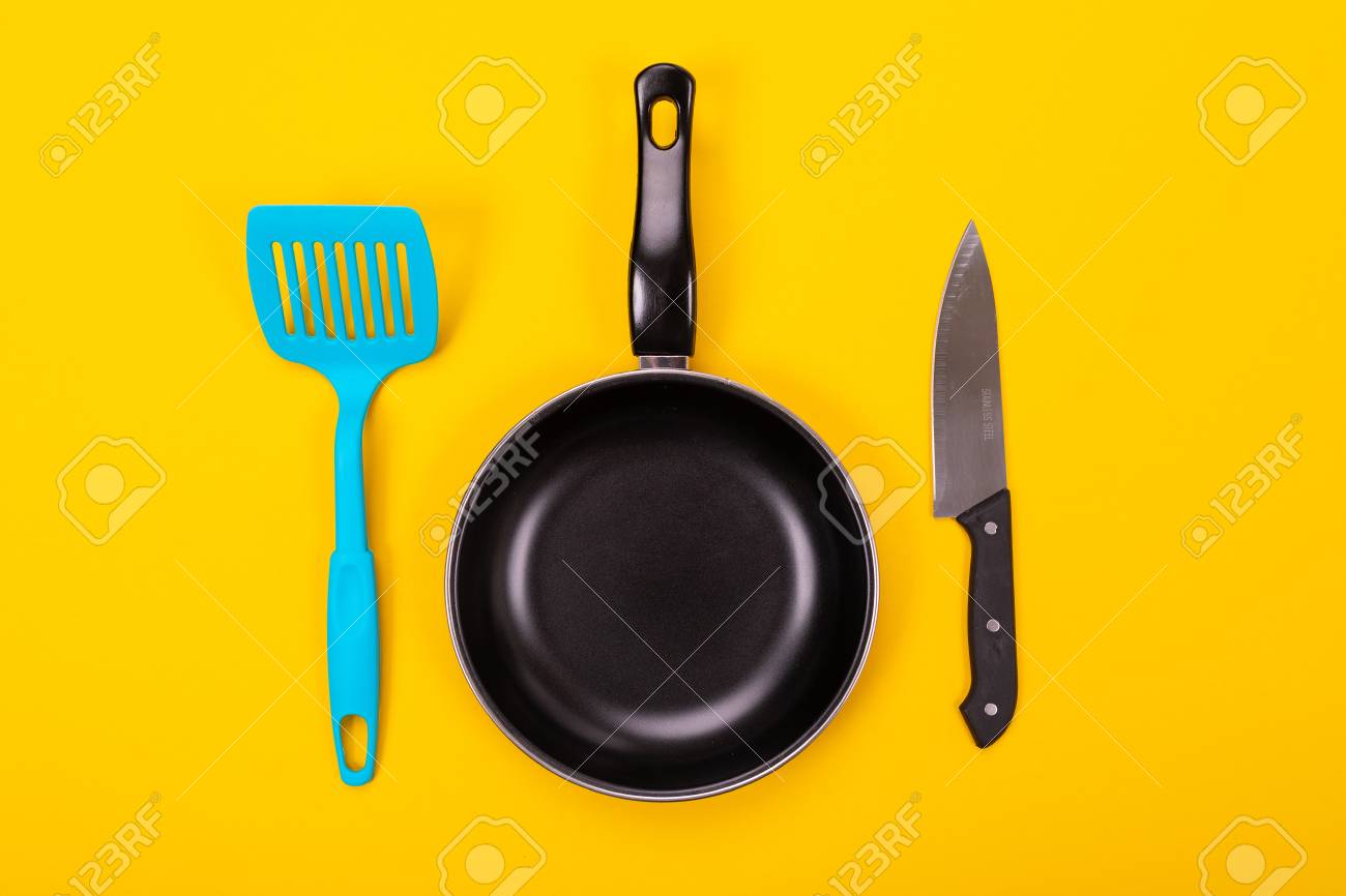 Close Up Picture Of Frying Pan With Spatula And Knife As Kitchen Utensils For Cooking Concept Stock Photo Picture And Royalty Free Image Image 115369900