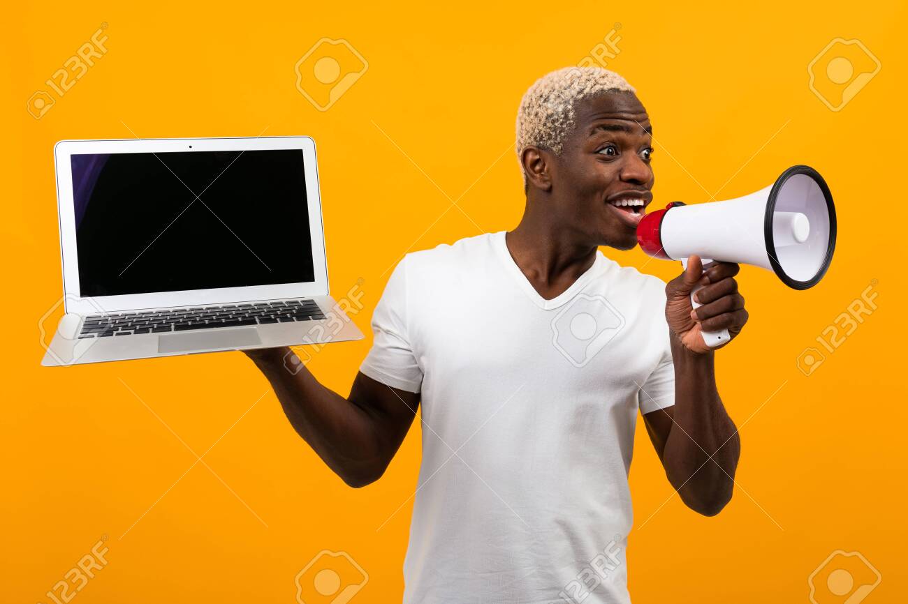 Download African Black Man With White Hair Speaks In A Megaphone Holding Stock Photo Picture And Royalty Free Image Image 139334894
