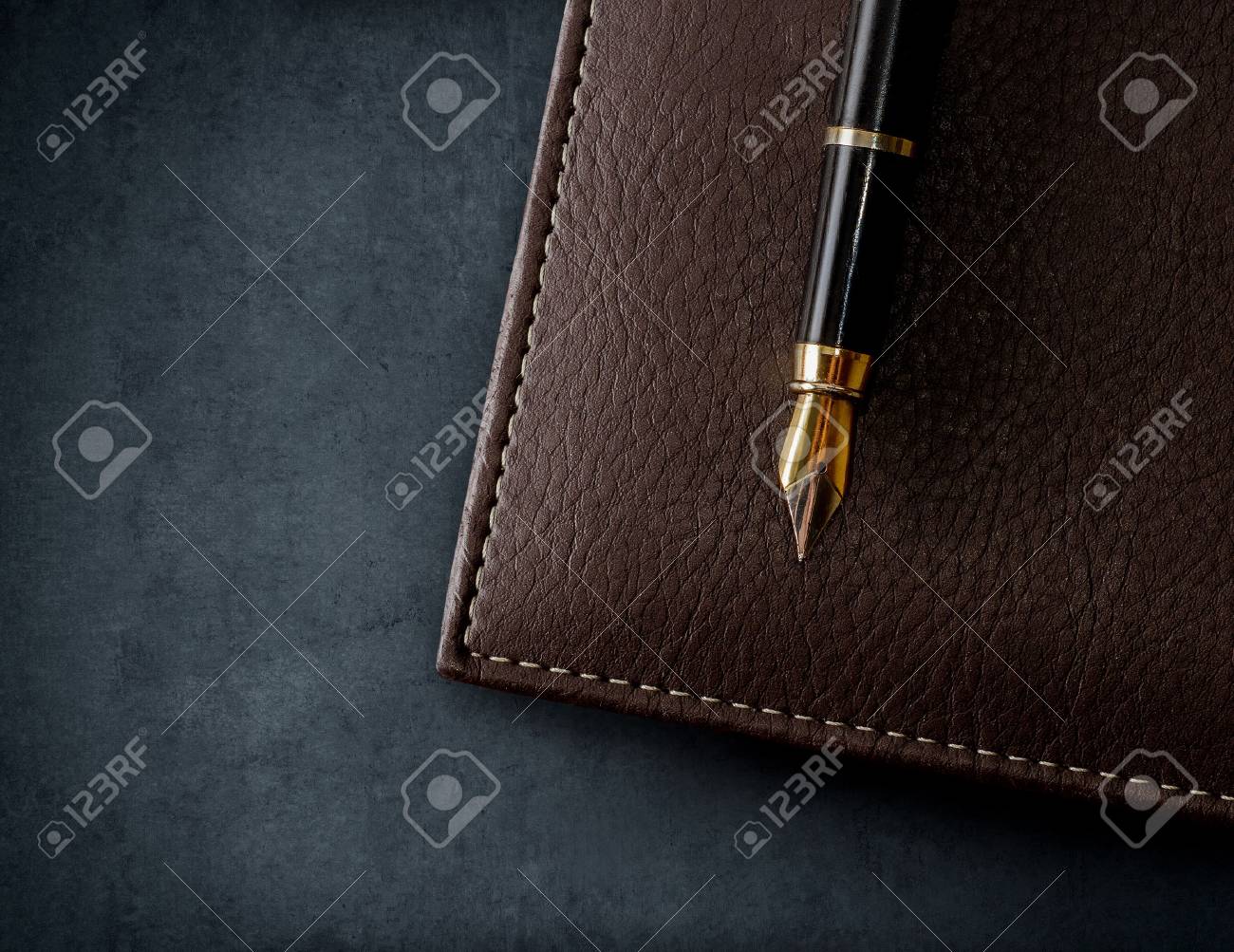 Leather brown notebook with fountain pen. Business background. - 66293909 Leather brown notebook with fountain pen. Business background. - 66293909