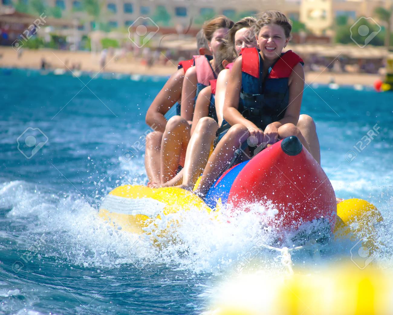 People ride on banana boat - 73580687 People ride on banana boat - 73580687