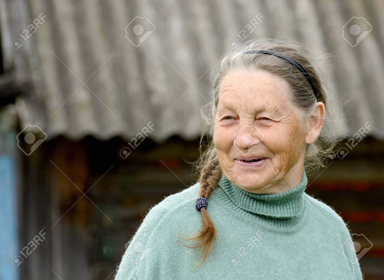 Portrait of smiling elderly woman outdoors - 81037949 Portrait of smiling elderly woman outdoors - 81037949