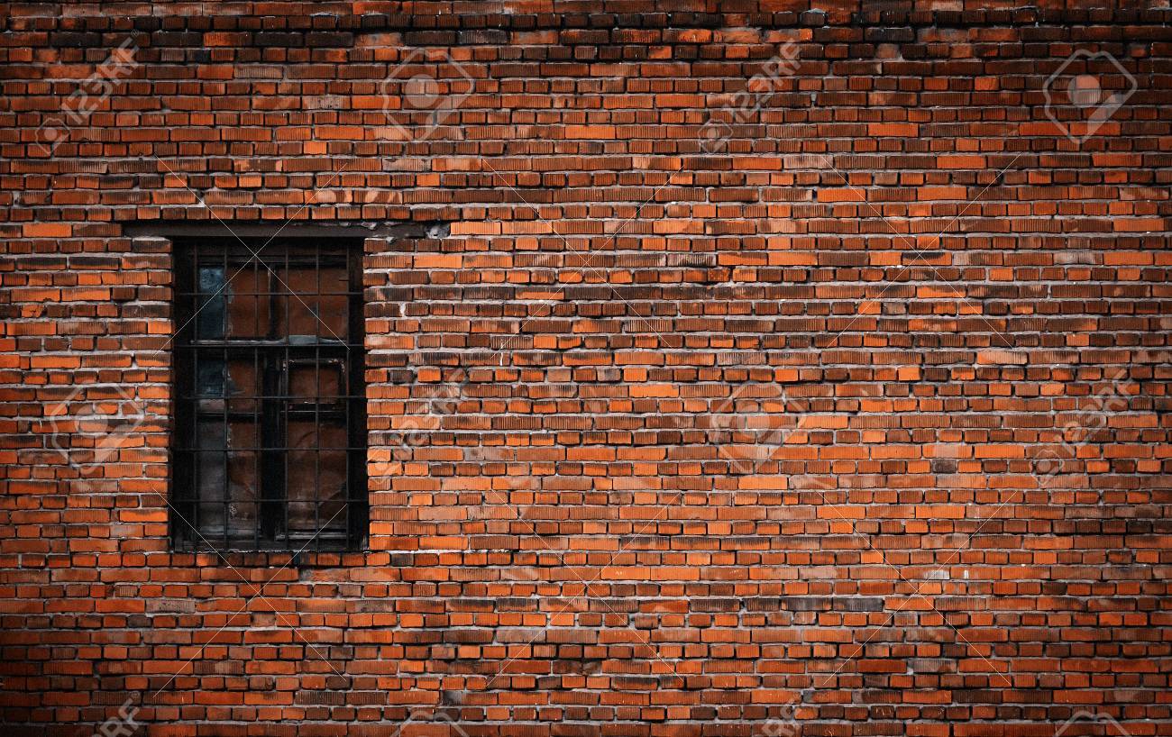 Old black brick wall and window locked with metal bars - 83086622 Old black brick wall and window locked with metal bars - 83086622