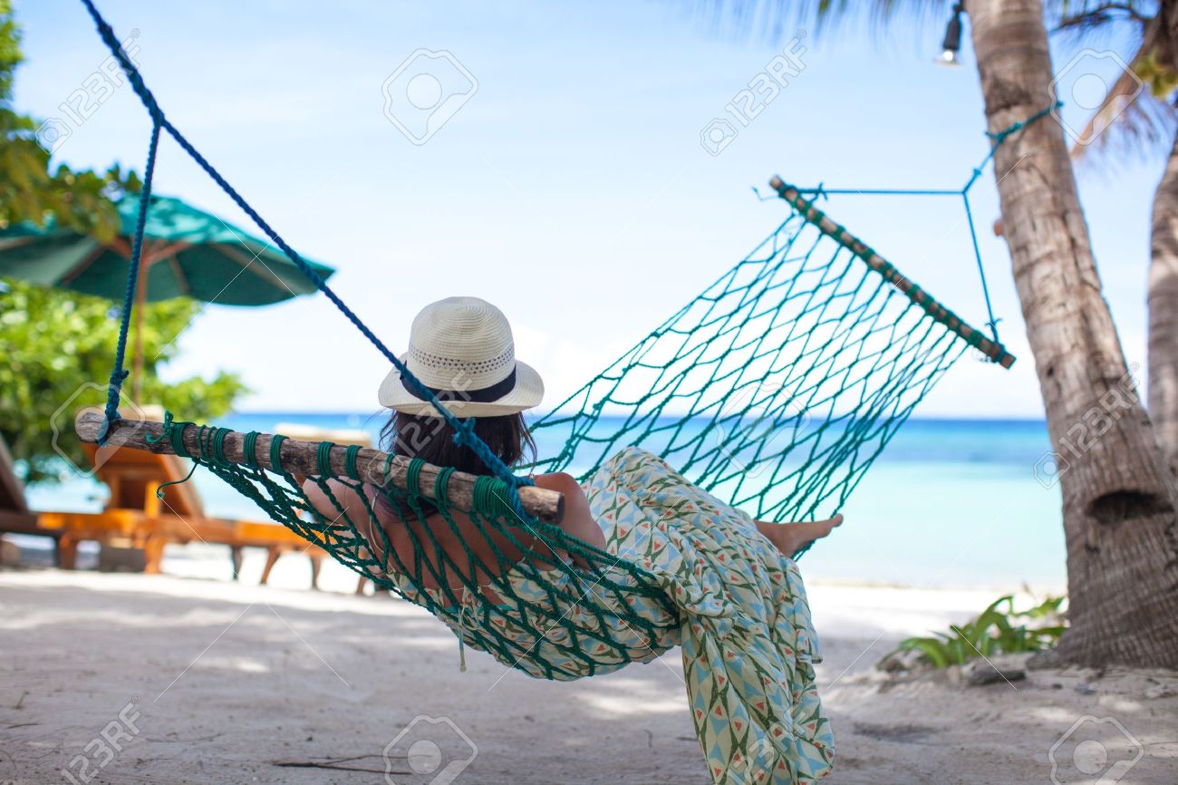 Woman In Hat Lying In Hammock In Tree's Shadow On A Beach Stock Photo, Picture And Royalty Free Image. Image 20756989.