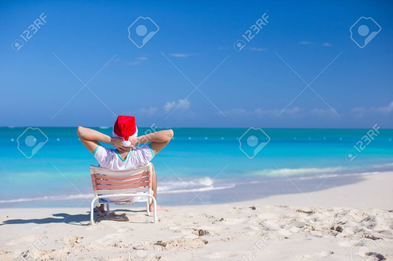 Back View Of Young Man In Santa Hat Relax At Beach Chair Stock Photo Picture And Royalty Free Image Image 30817383