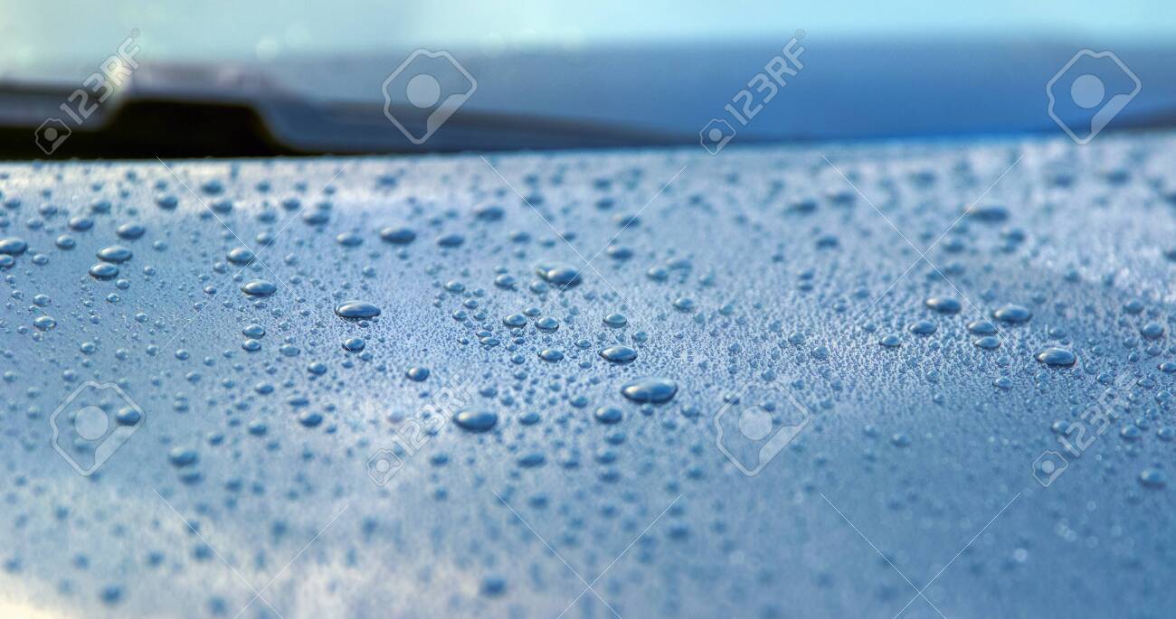 Beautiful drops of water on the polished bonnet of a clean car - shallow depth of field - copy space - 130118842 Beautiful drops of water on the polished bonnet of a clean car - shallow depth of field - copy space - 130118842