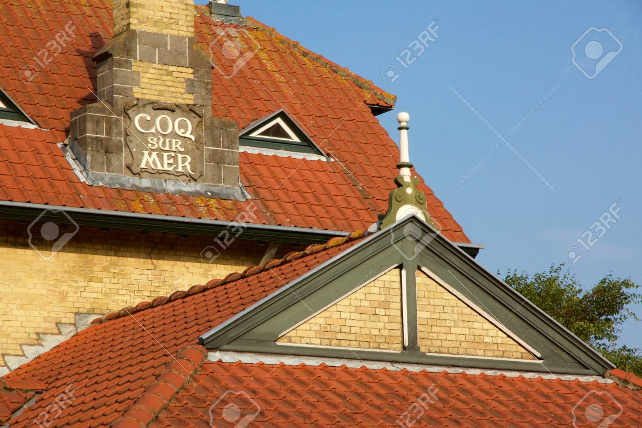 Historical architecture in De Haan, Belgium in Belle Epoque style with an interesting red roofed townhouse against a blue sky - 78451776 Historical architecture in De Haan, Belgium in Belle Epoque style with an interesting red roofed townhouse against a blue sky - 78451776