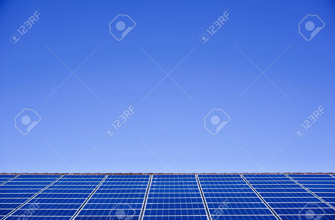 Photovoltaic panels on the roof of a supermarket with copyspace - 91996516 Photovoltaic panels on the roof of a supermarket with copyspace - 91996516