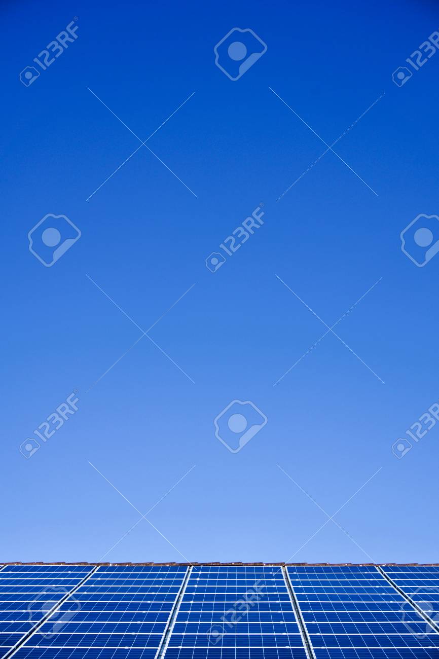 Photovoltaic panels on the roof of a supermarket with copyspace - 91951024 Photovoltaic panels on the roof of a supermarket with copyspace - 91951024
