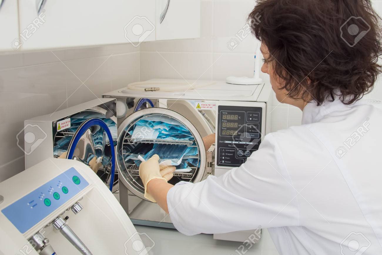 instrument sterilization in dentistry nurse loading instrumenst dentistry nurse