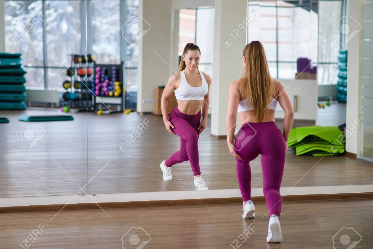 Beautiful Fitness Model Girl With Perfect Body And Shape Posing In Gym Near Mirror Sporty And Healthy Woman Lifestyle Stock Photo Picture And Royalty Free Image Image 118911224