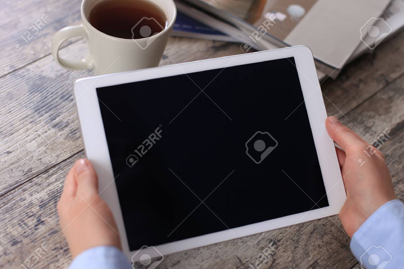 Digital tablet computer with isolated screen in female hands over cafe background - 36206573 Digital tablet computer with isolated screen in female hands over cafe background - 36206573
