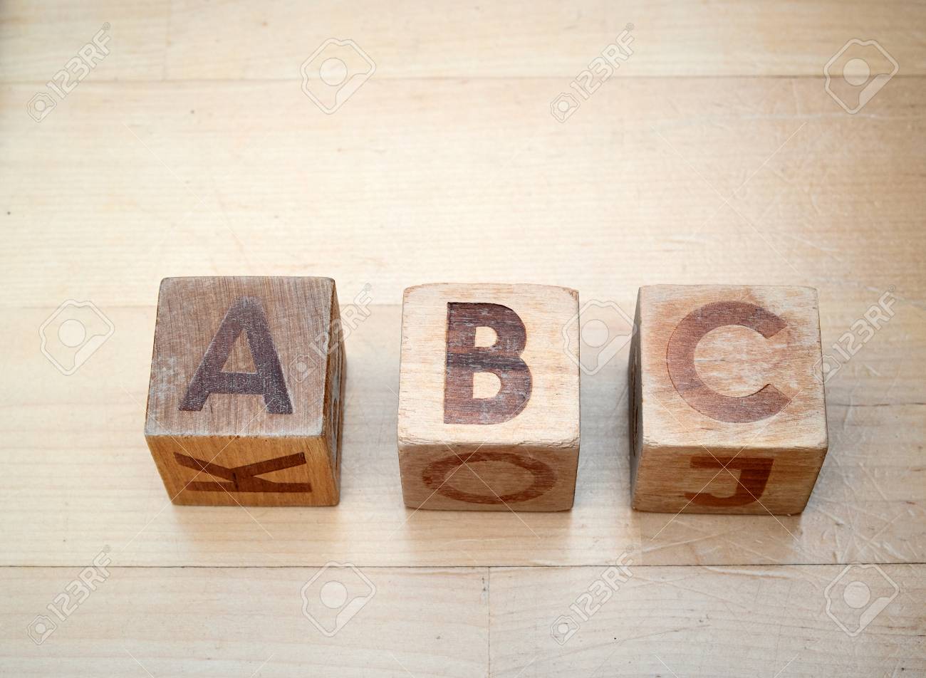 Wooden Alphabet Blocks Spelling Abc On Hardwood Floor Educational