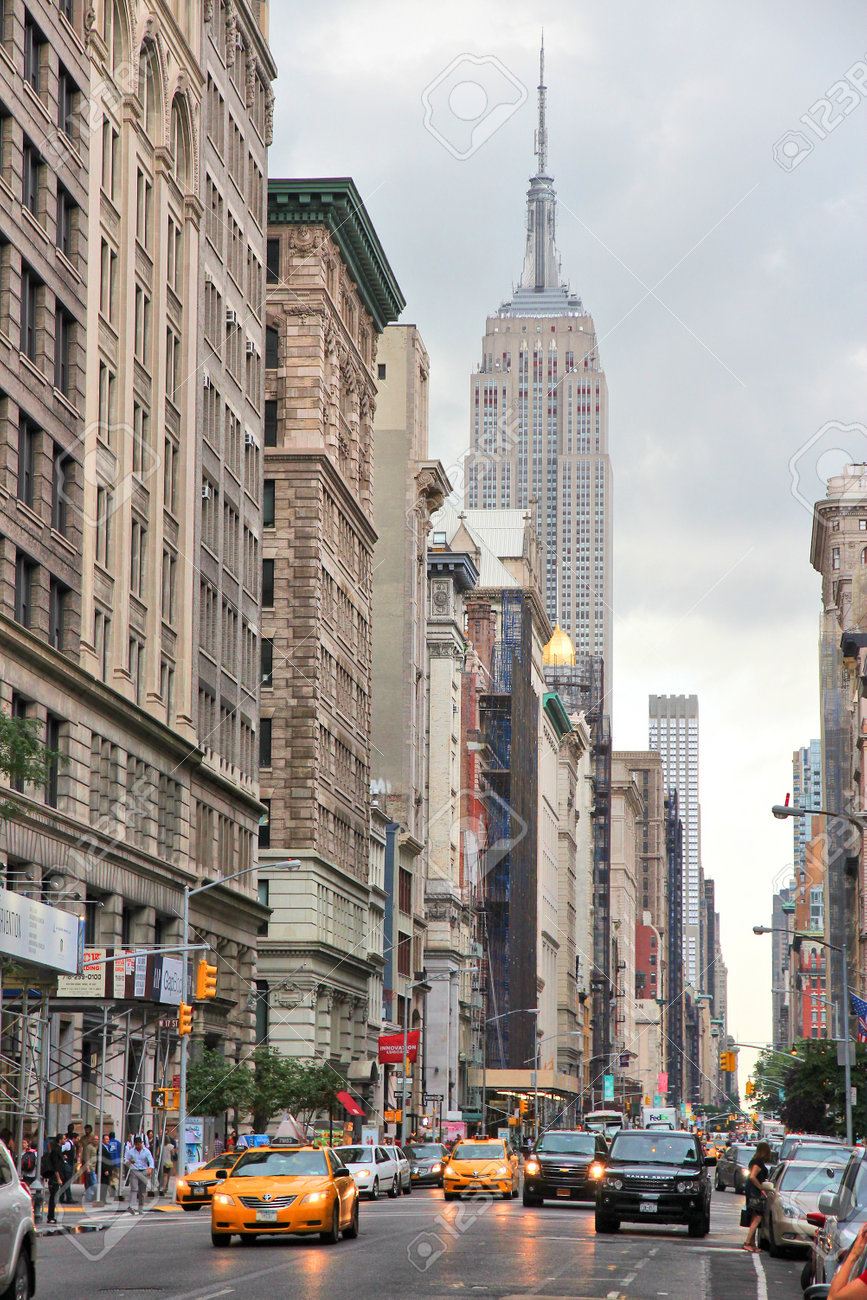 NEW YORK, USA - JULY 3, 2013: People visit 5th Avenue, Midtown Manhattan in New York. Almost 19 million people live in New York City metropolitan area. - 36654357 NEW YORK, USA - JULY 3, 2013: People visit 5th Avenue, Midtown Manhattan in New York. Almost 19 million people live in New York City metropolitan area. - 36654357