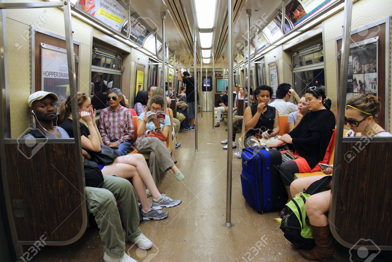 NEW YORK, USA - JULY 4, 2013: People ride Subway train in New York. With 1.67 billion annual rides, New York City Subway is the 7th busiest metro system in the world. - 37610095 NEW YORK, USA - JULY 4, 2013: People ride Subway train in New York. With 1.67 billion annual rides, New York City Subway is the 7th busiest metro system in the world. - 37610095