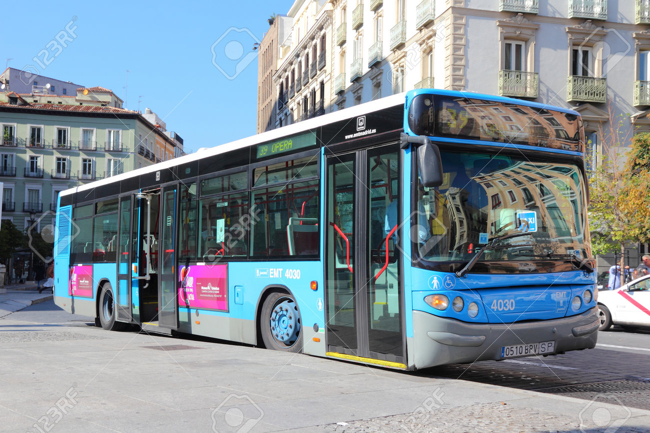 MADRID, SPAIN - OCTOBER 22, 2012: People ride city bus in Madrid. EMT is Madrid's main bus operator. It uses fleet of more than 2000 buses and serves about 450 million rides annually (2011). - 87197973 MADRID, SPAIN - OCTOBER 22, 2012: People ride city bus in Madrid. EMT is Madrid's main bus operator. It uses fleet of more than 2000 buses and serves about 450 million rides annually (2011). - 87197973