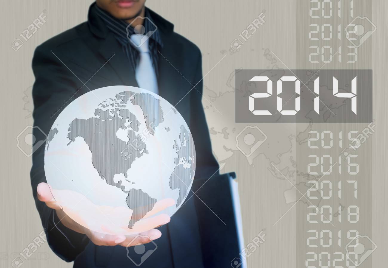 silver ball earth in hand businessman 2014 year - 22019952 silver ball earth in hand businessman 2014 year - 22019952