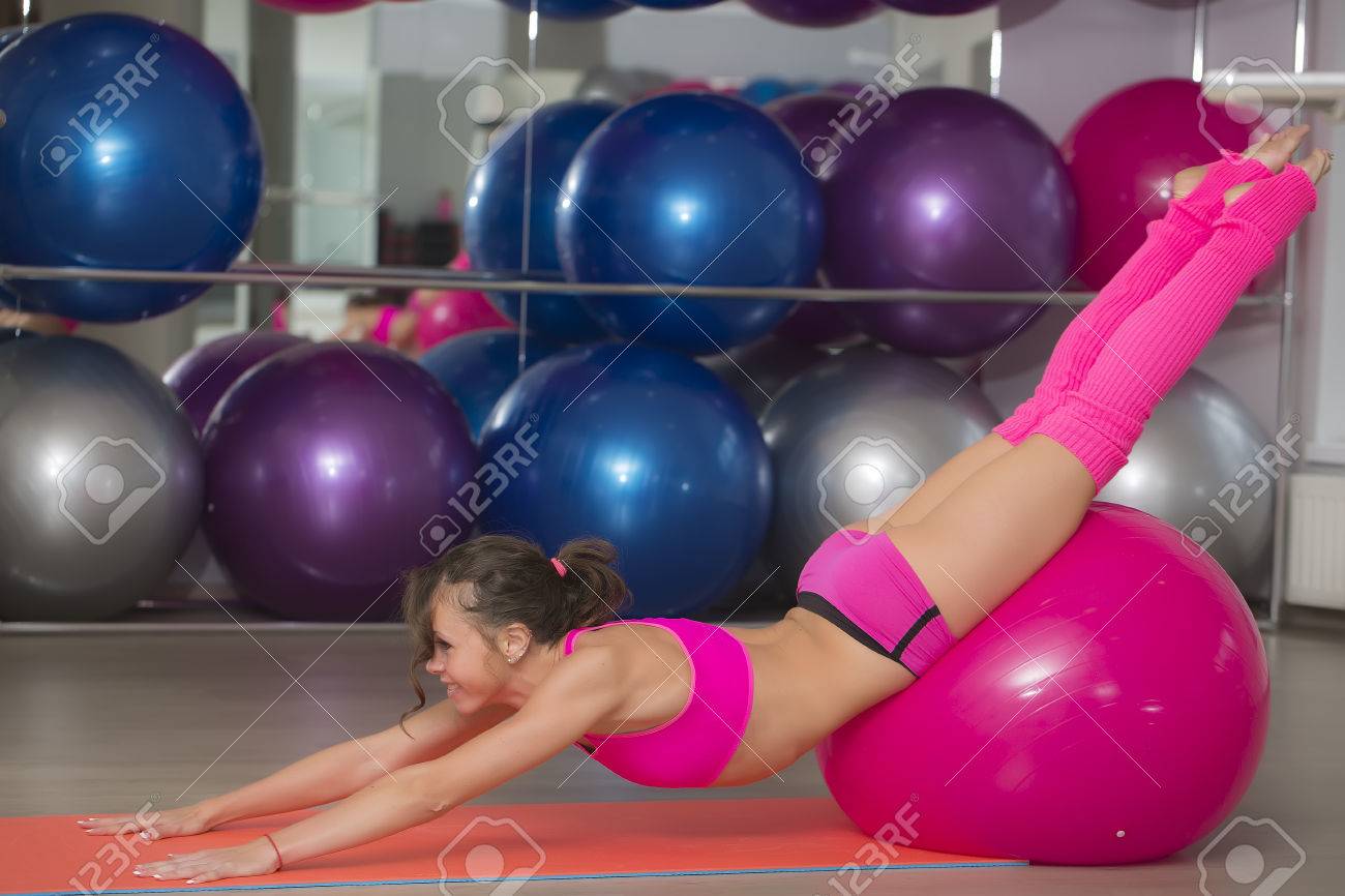Beautiful Flexible Sexy Fitness Girl With Musculat Body Lying On Floor On Mat Stretching And Gliding Beautiful Flexible Sexy Fitness Girl With Musculat Body Lying On Floor On Mat Stretching And Gliding