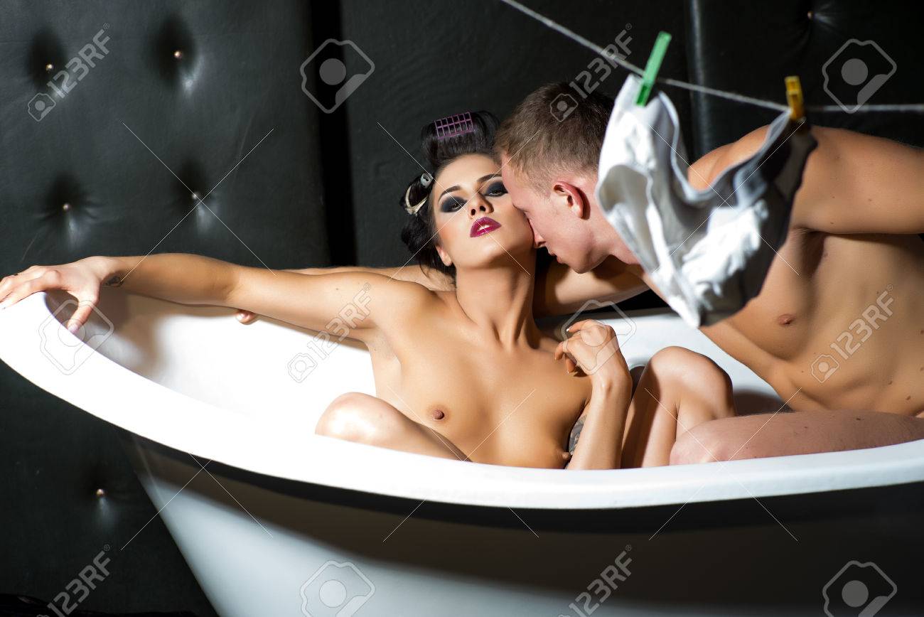 Young Nude Couple Together In Bathtub In Dark Bathroom With Hanging  Lingerie Stock Photo, Picture and Royalty Free Image. Image 43796331.