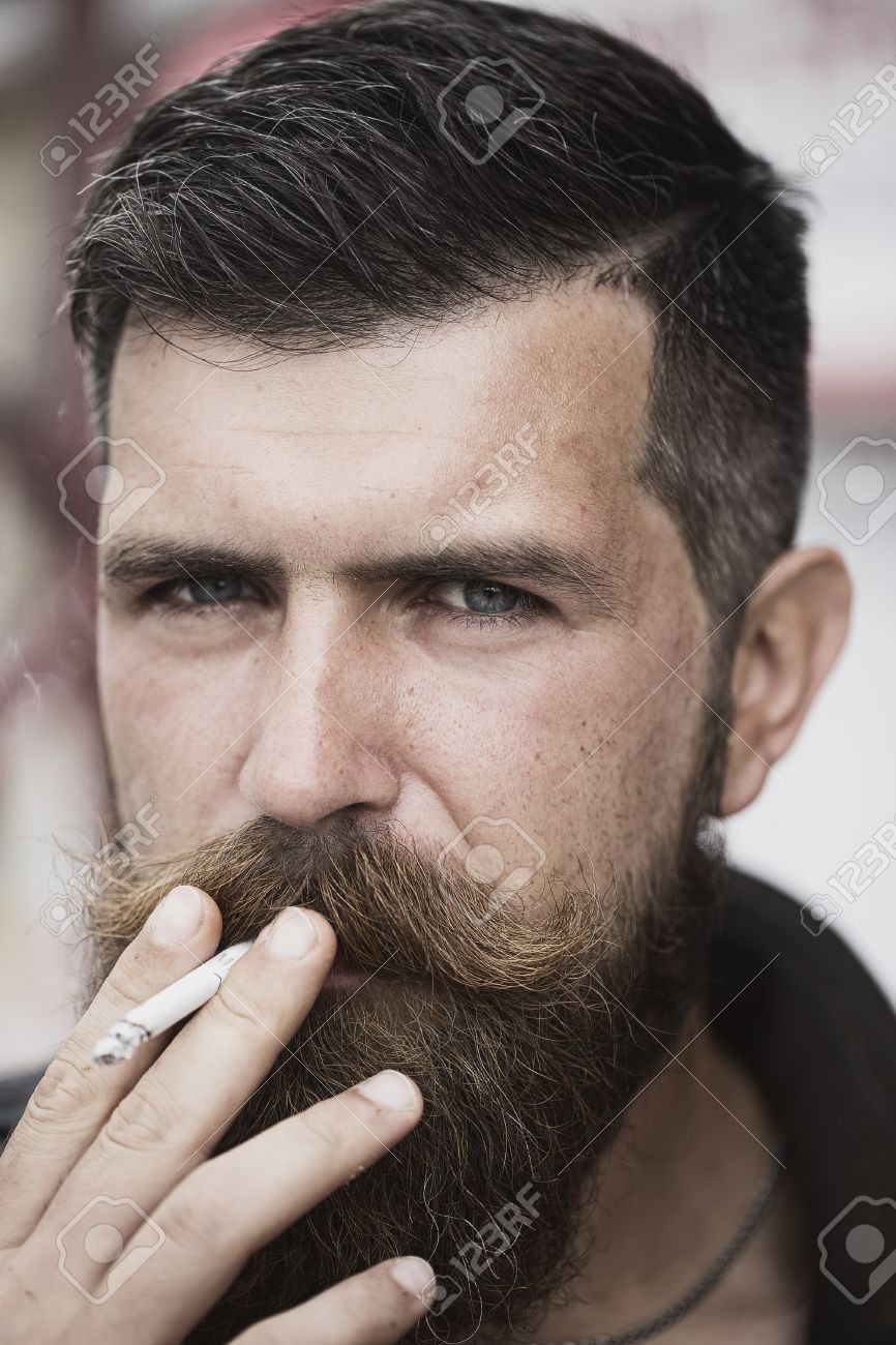 Portrait Of Handsome Unshaven Man With Beard And Handlebar Moustache