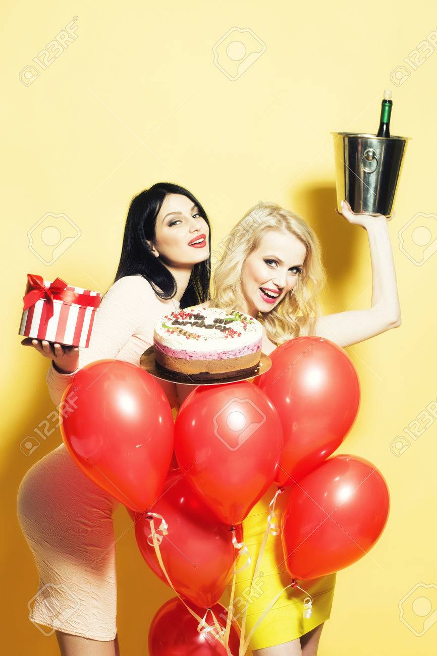 Feliz Cumple GAMOW - Página 2 49604536-two-cute-sexy-young-happy-blonde-and-brunette-women-holding-birthday-cake-with-candles-near-bunch-of