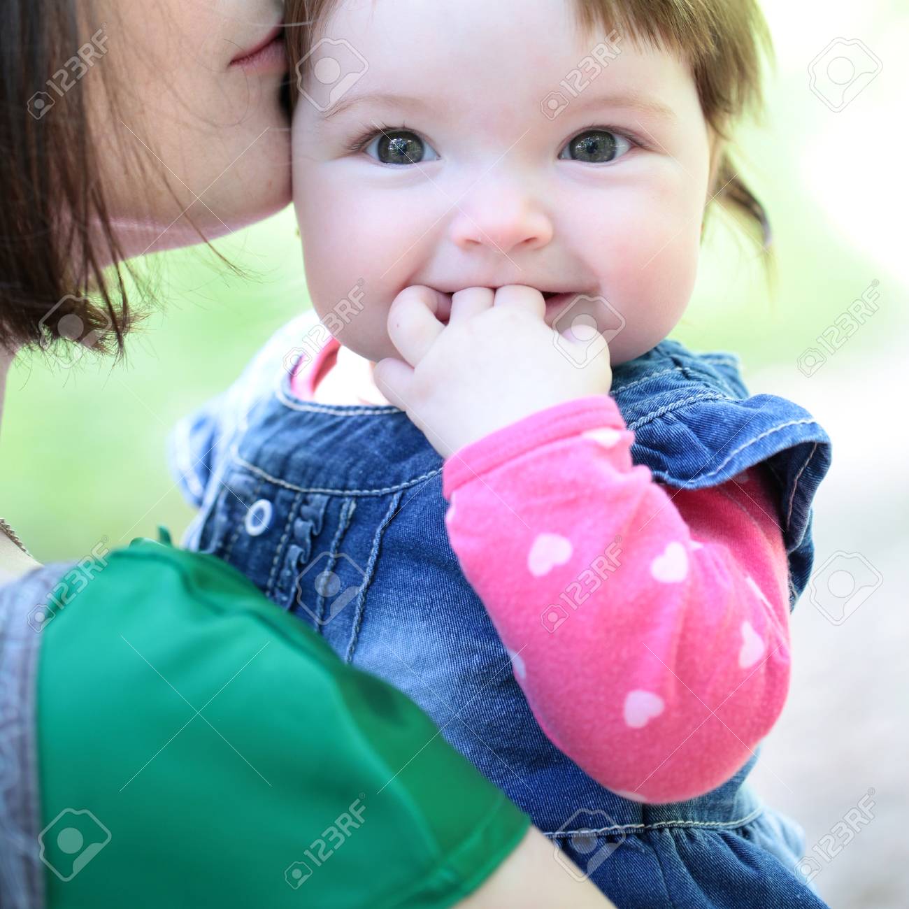 Small Cute Baby Girl With Pretty Smiling Face And Funny Eyes