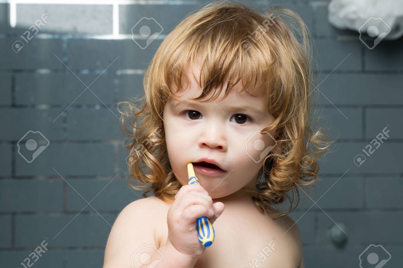 Small Cute Funny Baby Boy With Blonde Wet Hair In Bath Cleaninng