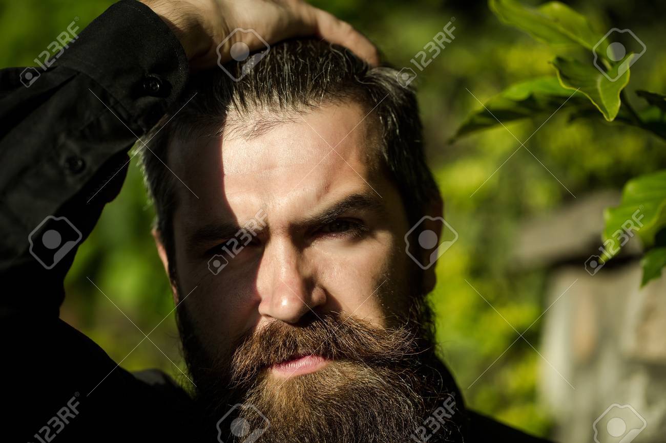 Handsome Sexy Bearded Young Man Hipster With Long Beard And Mustache Stock Photo Picture And Royalty Free Image Image 61760860