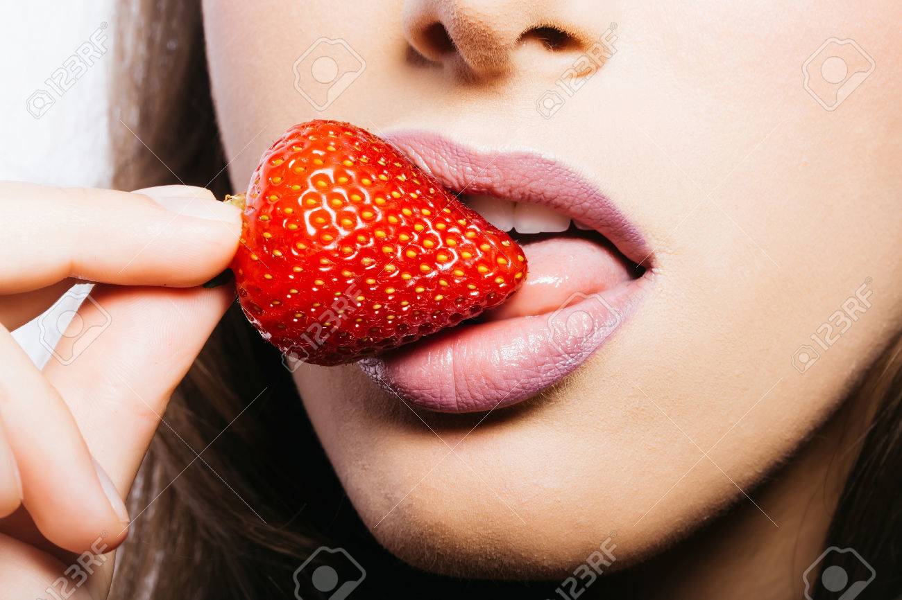 Sexy Female Mouth With Pink Lipstick On Lips Eating And Licking With Tongue Red Sweet Strawberry Sexy Female Mouth With Pink Lipstick On Lips Eating And Licking With Tongue Red Sweet Strawberry