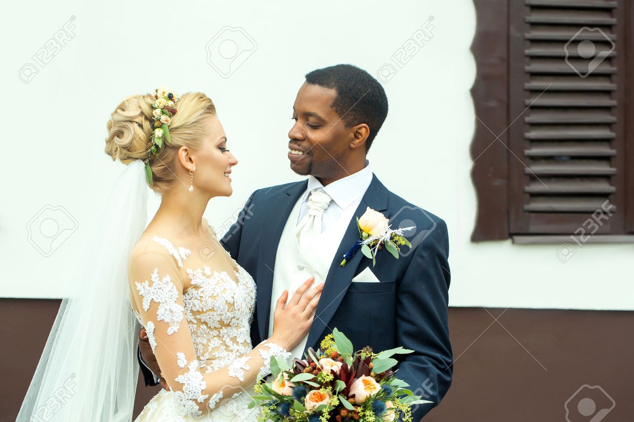 Young Man Elegant African American Groom Hugs Tenderly Beautiful