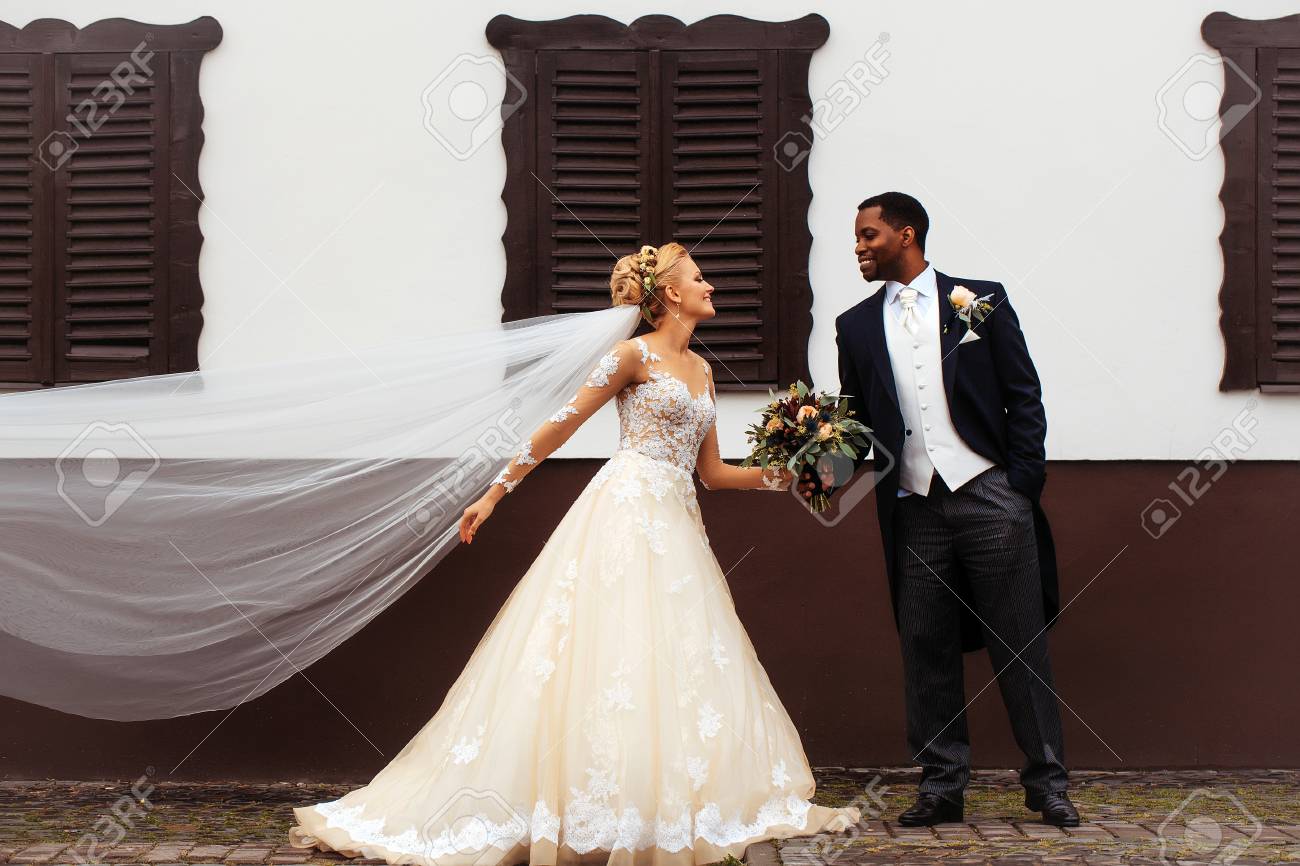 Beautiful Bride Woman In Long Elegant White Lace Dress Veil And