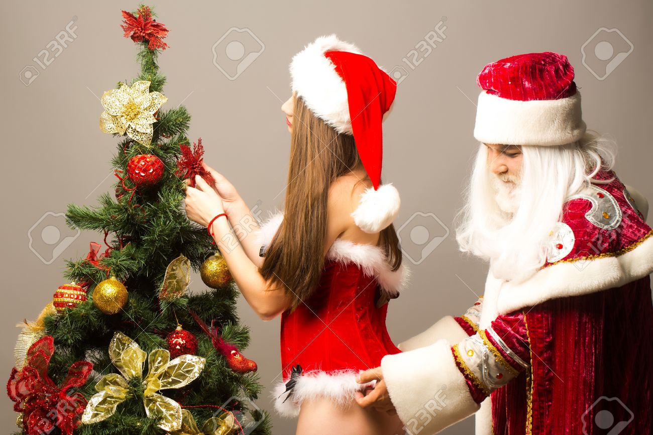 girl decorating christmas tree