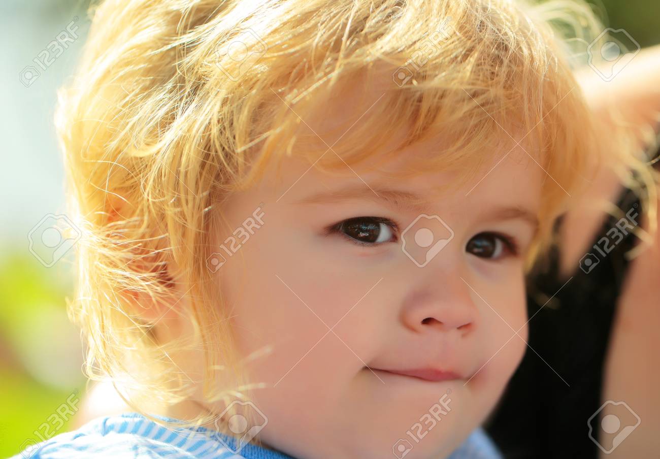 Cute Baby Boy With Adorable Face Brown Eyes And Blond Hair Poses