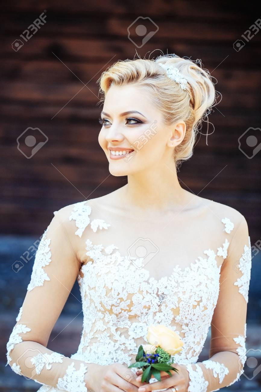 Happy Pretty Girl Or Cute Bride With Beautiful Makeup And Blond