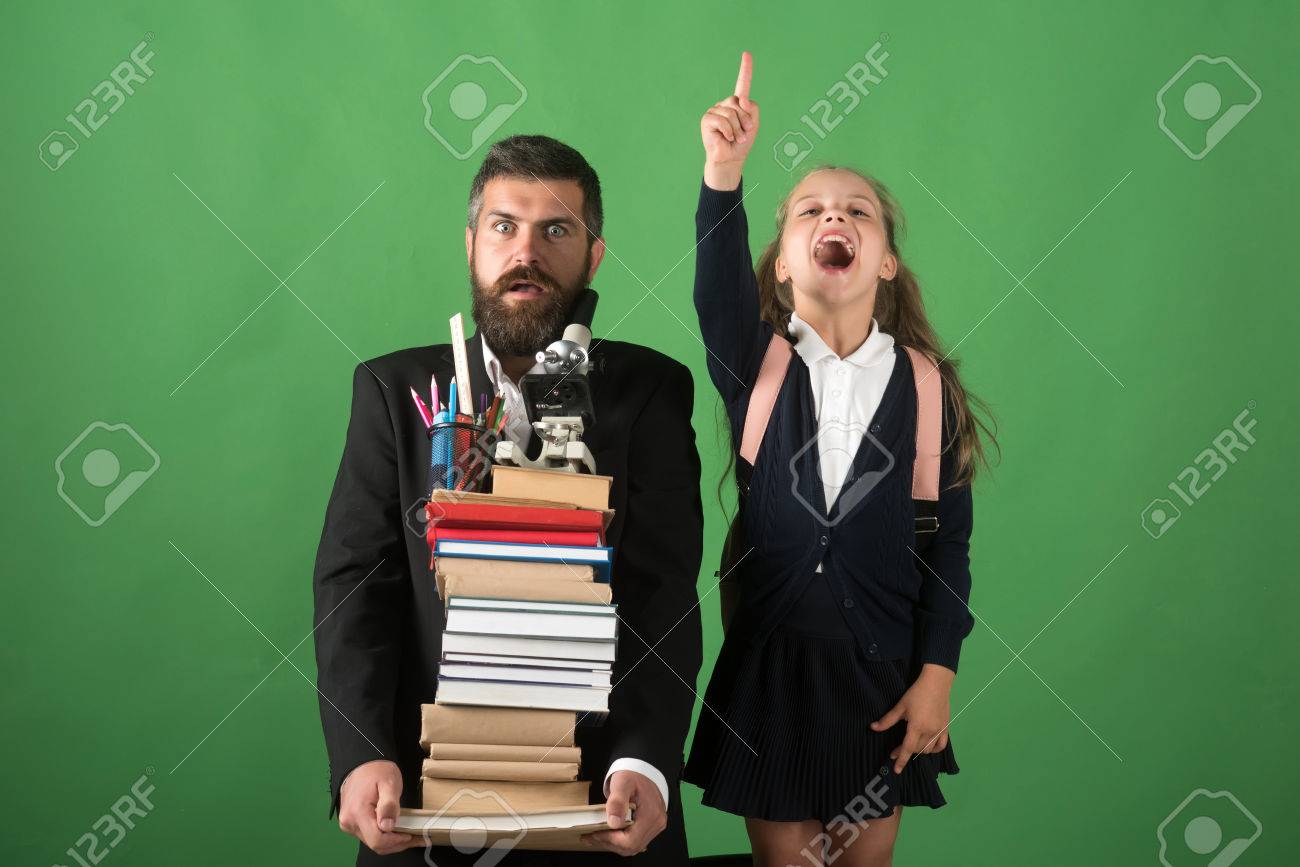 Stock Photo Teacher And Schoolgirl With Scared And Enthusiastic Faces On Green Background Kid And Tutor Hold Books Stationery And Microscope Stock Photo Teacher And Schoolgirl With Scared And Enthusiastic Faces On Green Background Kid And Tutor Hold Books Stationery And Microscope