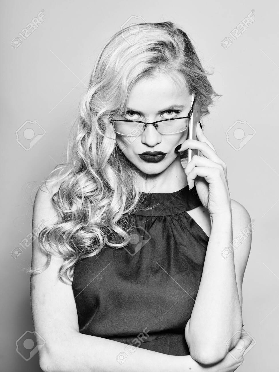 Pretty Young Woman With Red Lipstick And Long Blond Curly Hair